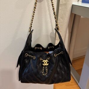 CHANEL 25 Small in Black grained calfskin with gold toned hardware. Full set.